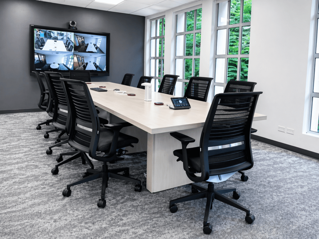 Corporate boardroom with integrated video conferencing and AV control system